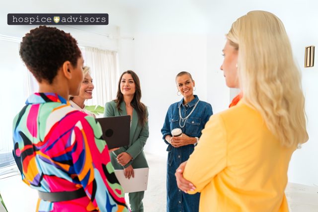 A diverse group of professionals in a collaborative meeting, discussing hospice growth strategies and differentiators during a training or boot camp session A diverse group of professionals in a collaborative meeting, discussing hospice growth strategies and differentiators during a training or boot camp session